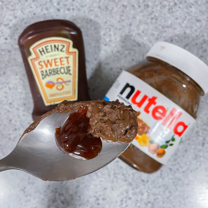 a hand in frame shot of nutella and BBQ sauce