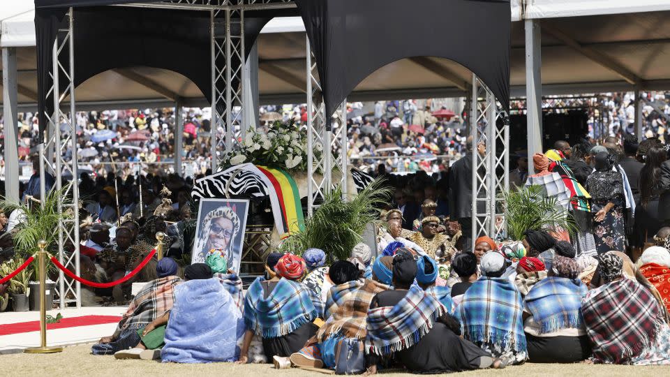 At a stadium in the town of Ulundi, mourners gathered around the coffin of Buthelezi, who died aged 95. Some dressed in traditional Zulu outfits made of leopard and other animal skins and held shields crafted from cow hides. - Marco Longari/AFP/Getty Images