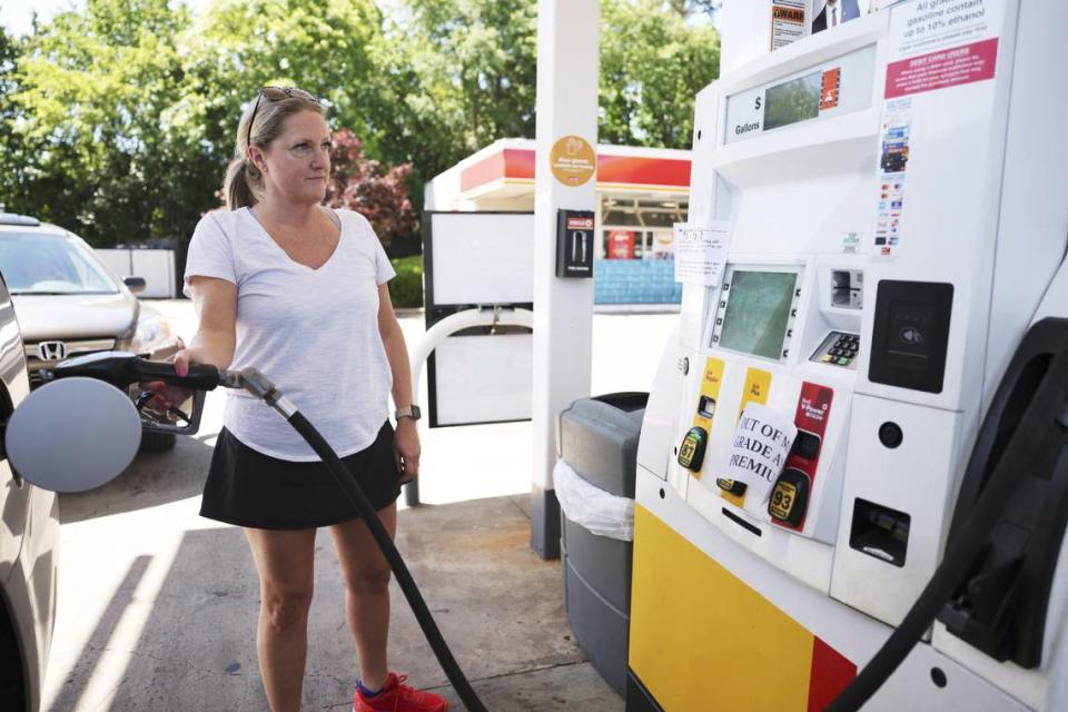 Amy Williams gets gas at the Circle K on Randolph Road in Charlotte, N.C., on Thursday, May 13, 2021. Price per gallon of Regular gas is $2.89.