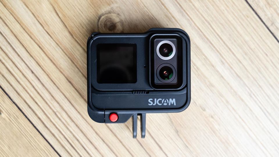 SJCAM SJ20 action camera on a wooden floor