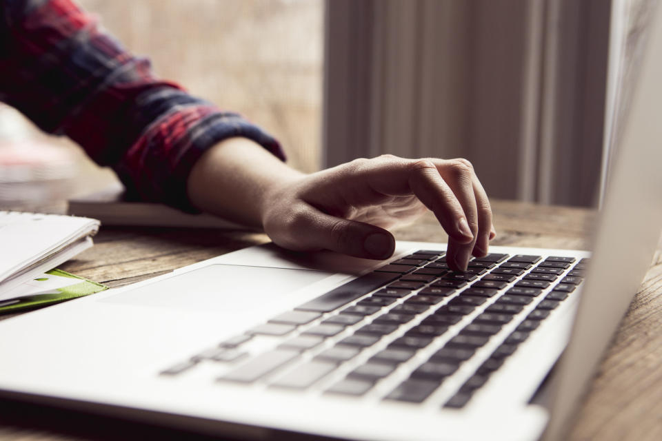 A woman using a laptop computer.