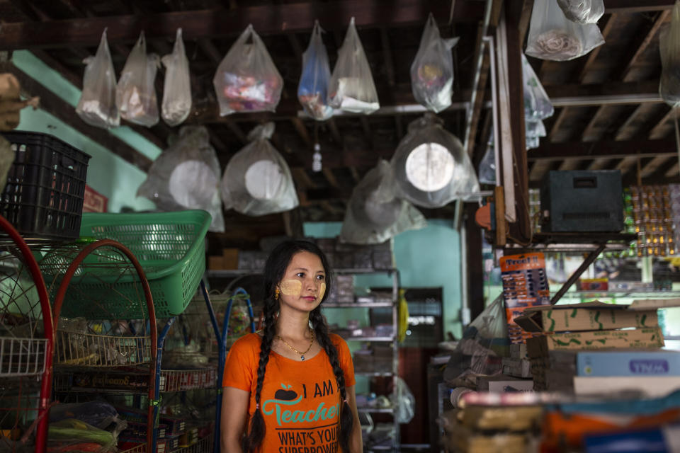 Lai Lai Swe, 32, poses in her shop in Mingalun village, in Yangon division, Myanmar. (Photo: Hkun Lat for HuffPost)