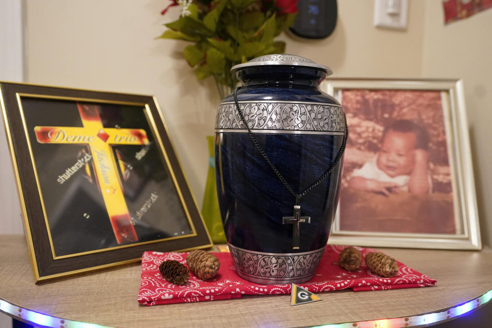 An urn holding the ashes of Demetrio Jackson is displayed in the home of his mother, Rita Gowens, Monday, Feb. 27, 2023, in Anderson, Ind. (AP Photo/Darron Cummings)