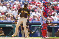 San Diego Padres' Jurickson Profar, left, scores on a hit by Robinson Cano as Philadelphia Phillies catcher Garrett Stubbs, right, looks on during the fourth inning of a baseball game, Thursday, May 19, 2022, in Philadelphia. (AP Photo/Chris Szagola)