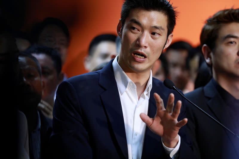 Future Forward Party leader Thanathorn Juangroongruangkit talks to reporters after Thailand's Constitutional Court ruled that key figures of the opposition Future Forward Party were not guilty of opposing the monarchy, at the party's headquarters in