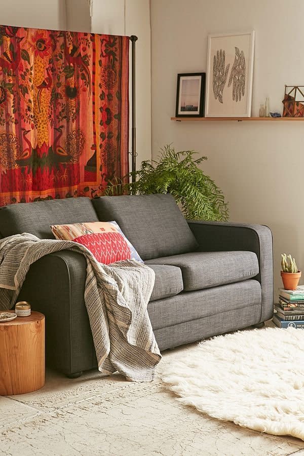 Functional furniture is a must in a small space. <a href="https://www.urbanoutfitters.com/shop/deco-convertible-sofa-004?category=furniture&amp;color=005&amp;quantity=1&amp;size=ONE%20SIZE&amp;type=REGULAR" target="_blank">This convertible sofa</a> is small but has enough required seating and comes with a&nbsp;foldout high-density foam cushion underneath.