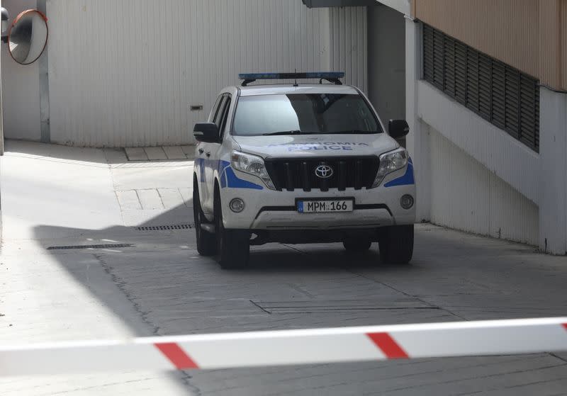 David Hunter, British pensioner facing murder charges over the death of his wife, leaves in a police car from a courthouse in Paphos