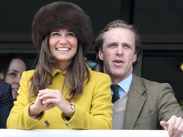 <p>Danny Martindale/Getty</p> Pippa Middleton and friend Tom Kingston watch the Queens Mother Champion Steeple Chase at Cheltenham Racecourse on March 14, 2013.