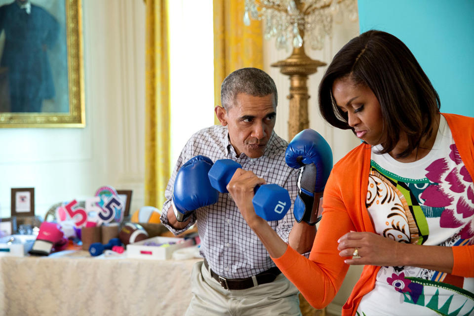 Barack and Michelle Obama at the Instagram #GimmeFive photo booth in the East Room of the White House during the annual Easter Egg Roll,&nbsp;April 6, 2015.