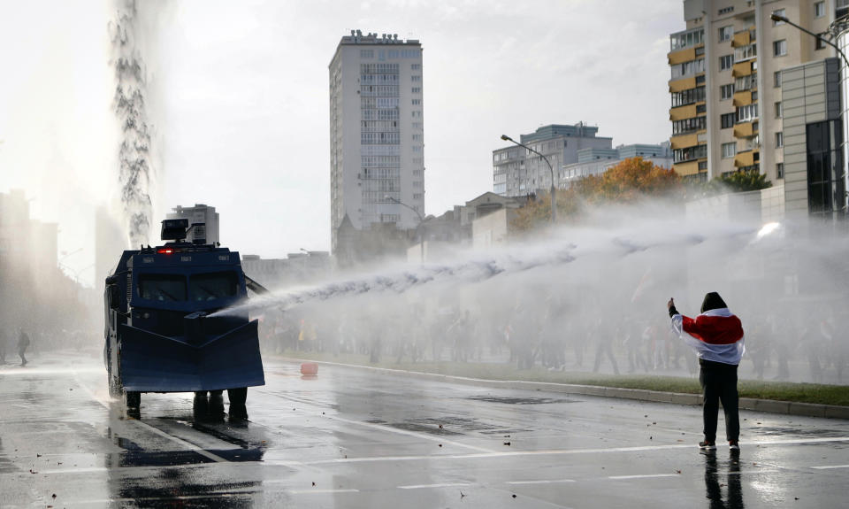 Police use a water cannon against demonstrators during a rally in Minsk, Belarus, Sunday, Oct. 4, 2020. Hundreds of thousands of Belarusians have been protesting daily since the Aug. 9 presidential election. (AP Photo)