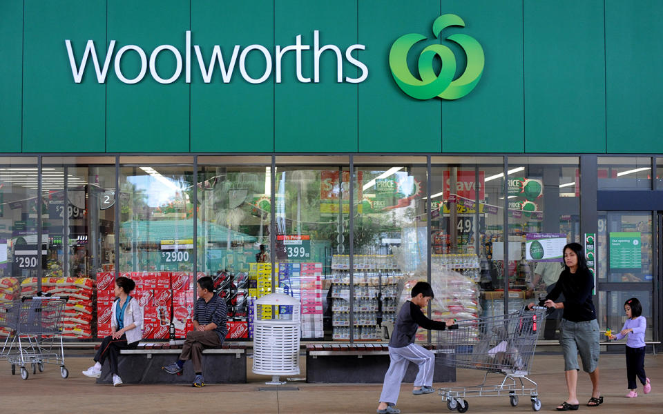 A family leave a Woolworths store. Source: Getty Images