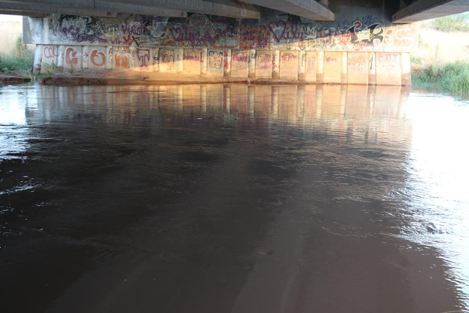 Flood waters rise along the Pecos River east of Artesia on Aug. 22, 2022. Flood waters near Carlsbad Caverns National Park prompted park officials and visitors to remain at the visitor center until flood waters receded on Aug. 20, 2022.