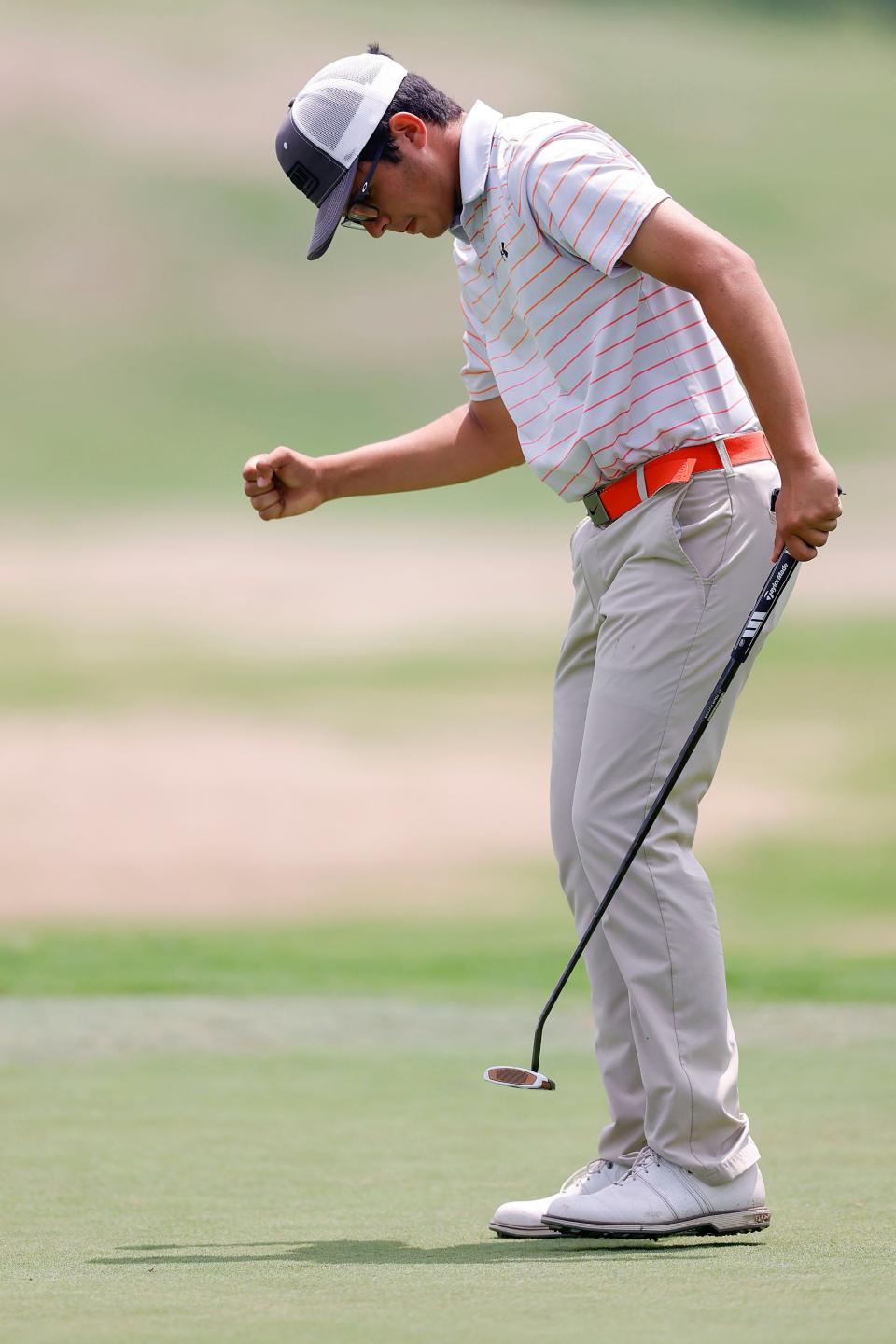 Sebastian Salazar of Norman High School pumps his fist as he sinks a par putt on the 18th green to finish his round during the final round of the 6A Boys Golf State Championship at Bailey Ranch Golf Glub Tuesday, May 9, 2023 in Owasso, Ok.