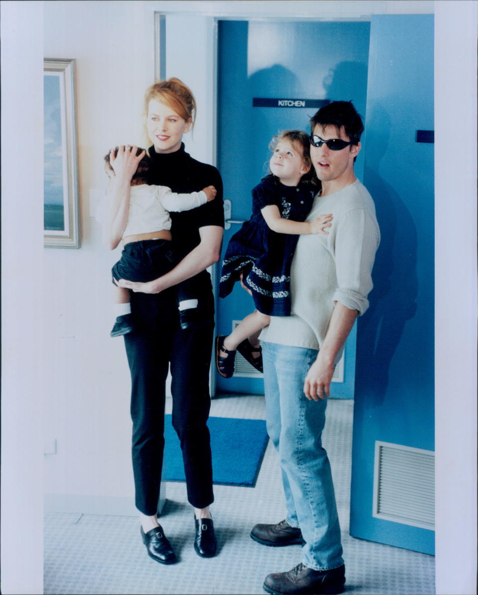 Nicole Kidman holding her infant son Connor and Tom Cruise holding their daughter Isabella on January 24, 1996