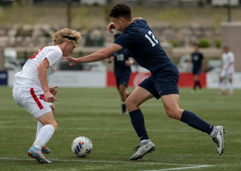 Manti’s Trace Justesen and Juan Diego’s Vladimir Leontieff compete for the ball in a 3A boys soccer state semifinal at Zions Bank Stadium in Herriman on Wednesday, May 10, 2023. | Spenser Heaps, Deseret News