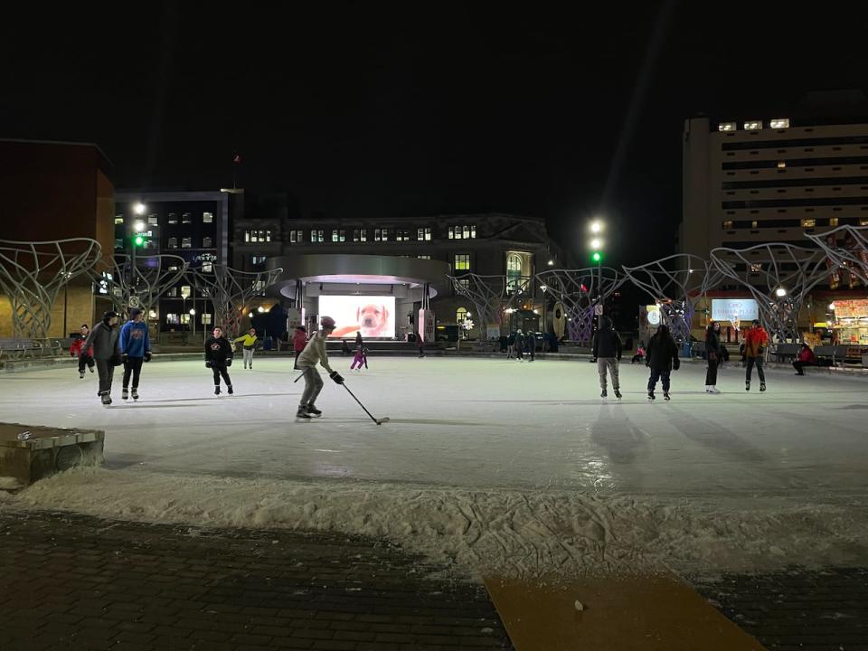 People skating on the Ian Fowler Oval on Jan. 2, 2023, which is part of the Avenir Centre plaza. 