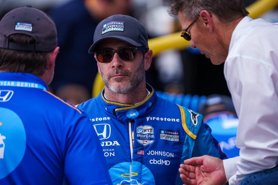 Chip Ganassi Racing driver Jimmie Johnson (48) talks with team members Friday, May 27, 2022, after his practice run during Carb Day at Indianapolis Motor Speedway.