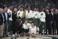 Milwaukee Bucks owners and players display their championship rings before an NBA basketball game between the Bucks and the Brooklyn Nets, Tuesday, Oct. 19, 2021, in Milwaukee. (AP Photo/Morry Gash)