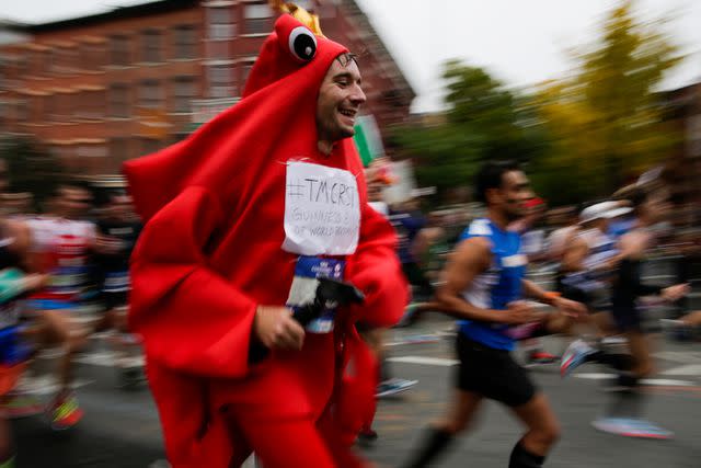<p>Eduardo Munoz Alvarez/Getty</p> Runners make their way on Lafayette Avenue during the 2017 TCS New York City Marathon