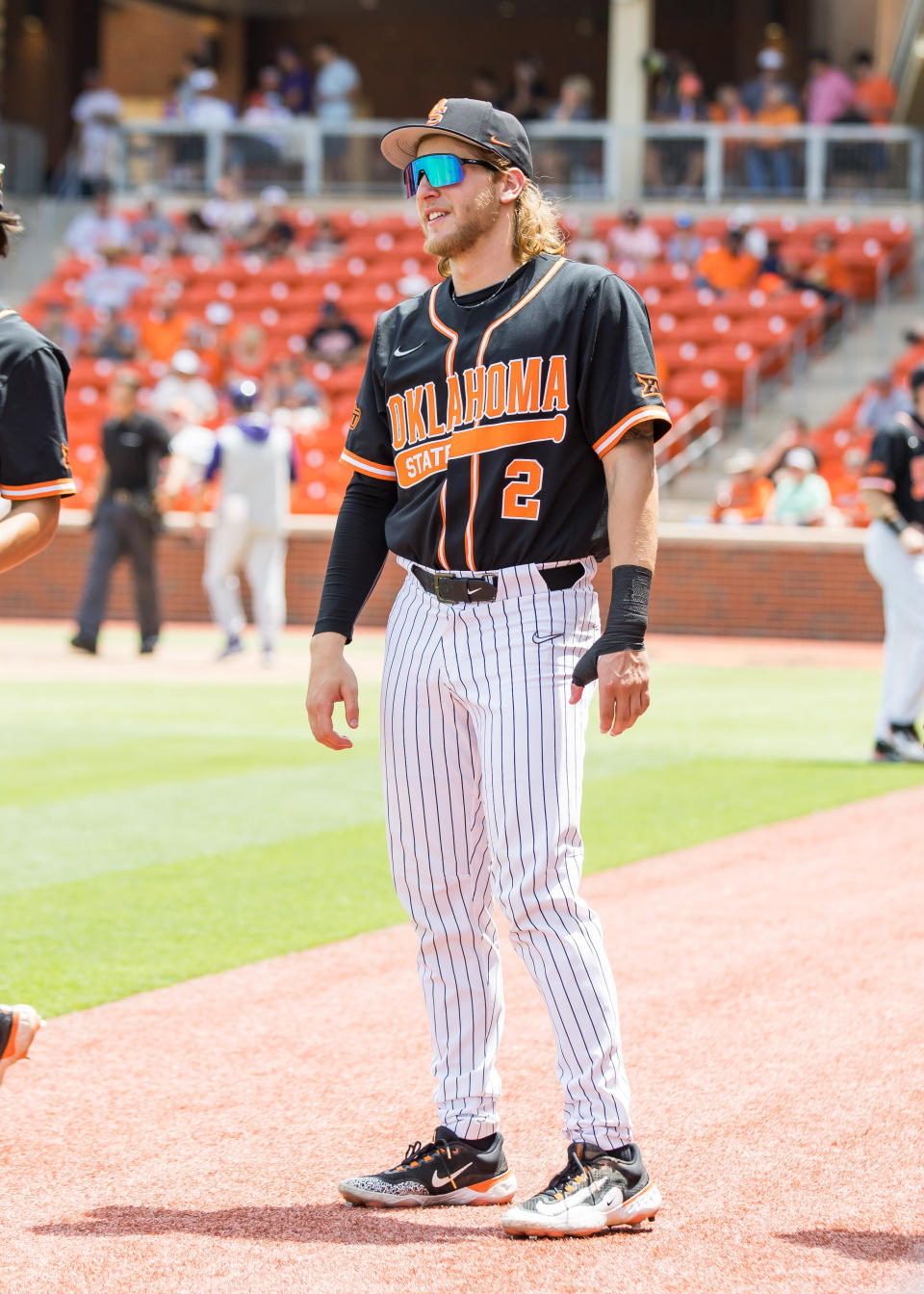 May 13, 2023; Stillwater, OK, USA; Oklahoma State Cowboys infielder Aidan Meola (2) waits on the players to exit the field during the game against the Kansas State Wildcats at O’Brate Stadium. Mandatory Credit: Brett Rojo-USA TODAY Sports
