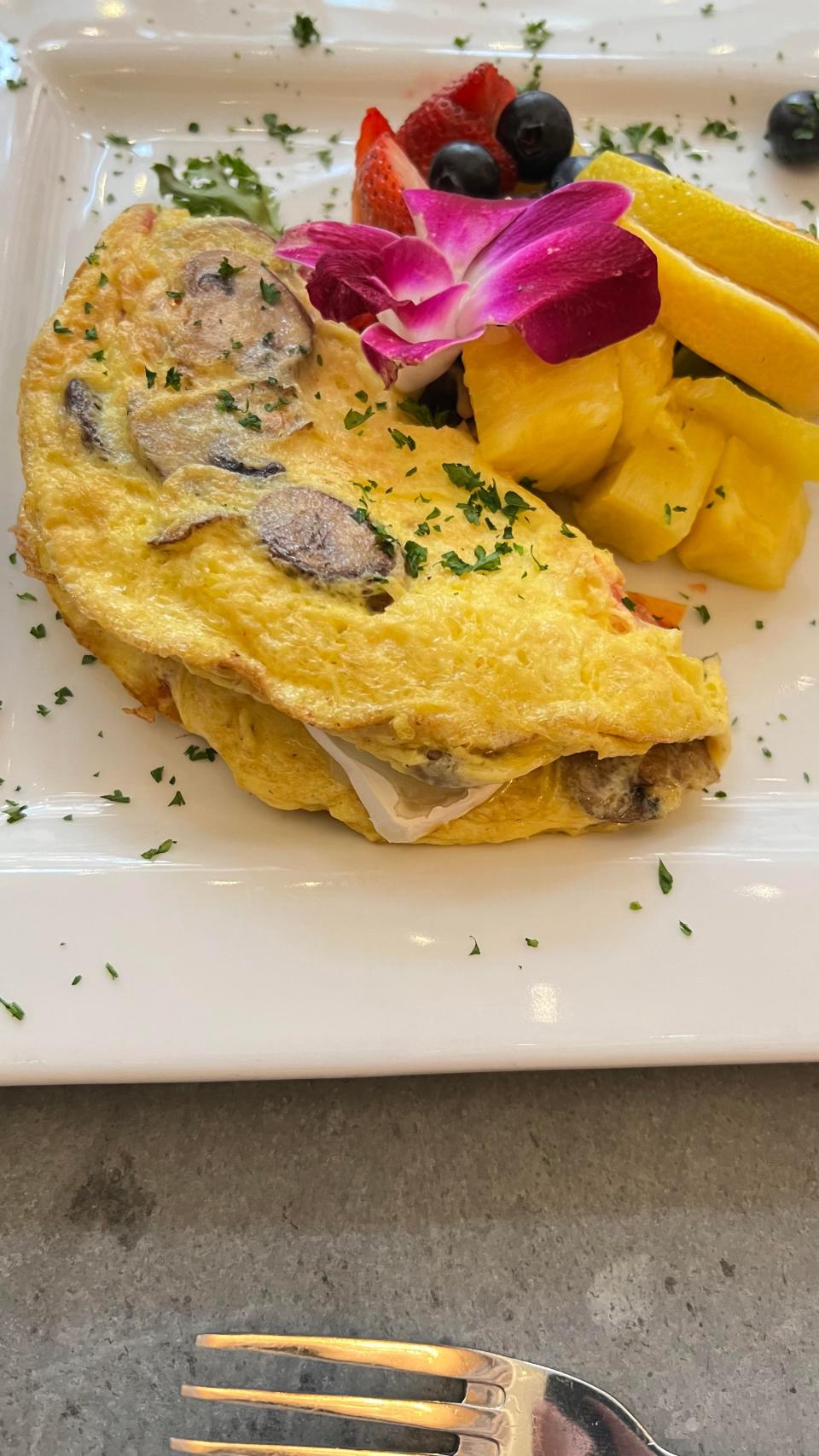 The fluffy brie and mushroom omelette at La Grande Martier in Stuart was filled with a generous portion of sauteed mushrooms, chopped tomatoes, and slices of brie.