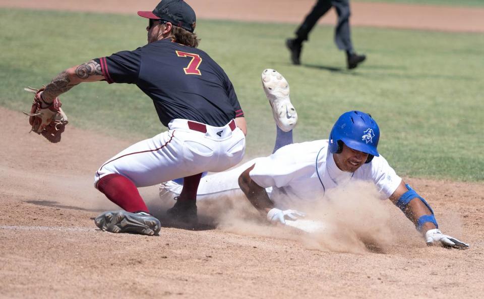 Modesto’s Paul Contreras slides safely into third on a triple during the 3C2A NorCal Regional playoff game with Sacramento City College at Modesto Junior College in Modesto, Calif., Friday, May 3, 2024. Modesto won the game 6-3. Andy Alfaro/aalfaro@modbee.com