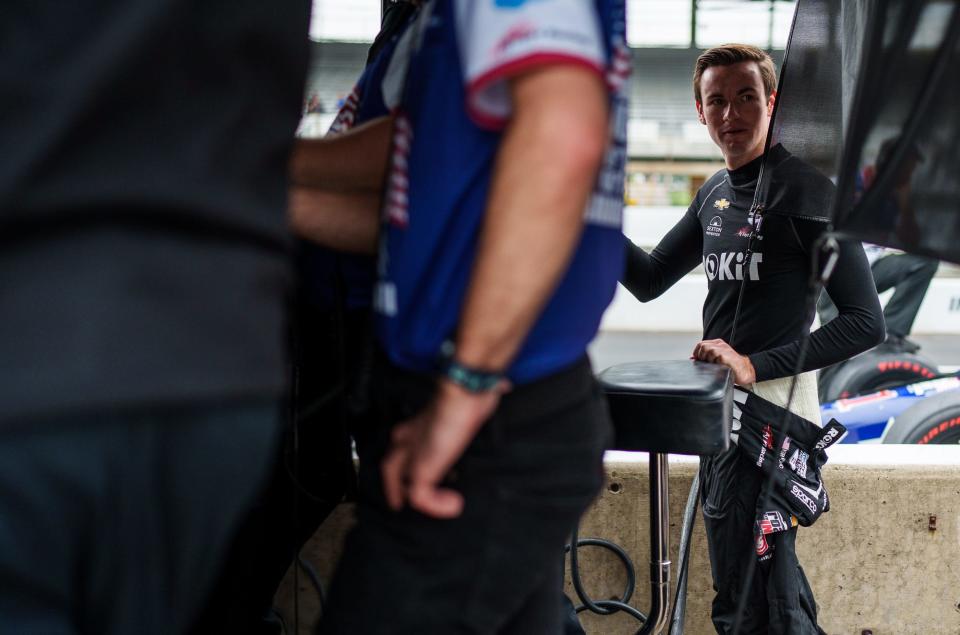 A. J. Foyt Enterprises driver Kyle Kirkwood (14) begins to suit up Saturday, May 21, 2022, during a morning practice session before qualifying for the 106th running of the Indianapolis 500 at Indianapolis Motor Speedway.