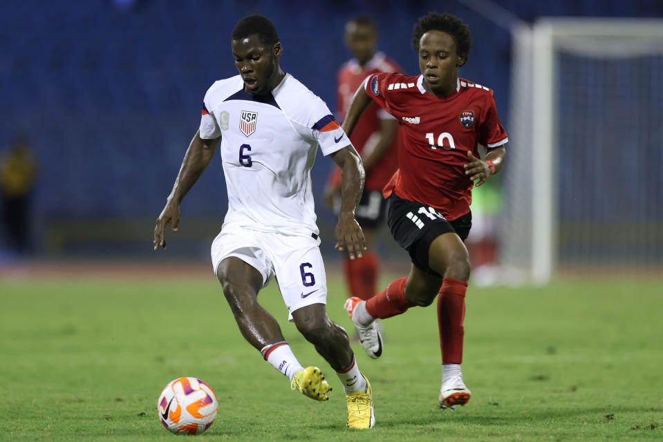 PORT OF SPAIN, TRINIDAD AND TOBAGO - NOVEMBER 20: Yunus Musah #6 of the United States is marked by Real Gill #10 of Trinidad and Tobago during the first half at Hasely Crawford Stadium on November 20, 2023 in Port of Spain, Trinidad And Tobago. (Photo by John Dorton/ISI Photos/USSF/Getty Images for USSF)