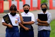 Students wear protective masks at a school amid coronavirus disease (COVID-19) pandemic in Jayapura