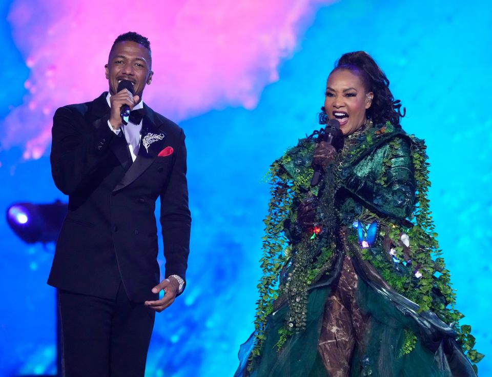 L-R: Host Nick Cannon and Vivica A. Fox, who turned out to be Mother Nature, in the “Back To School” episode of "The Masked Singer."