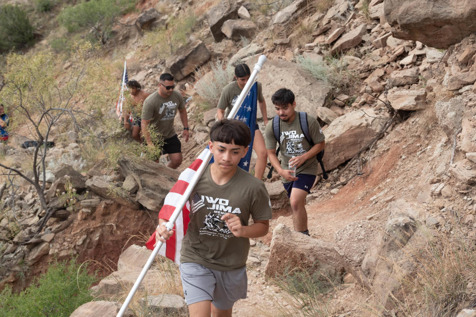 A team works its way through the CCC trail Saturday morning at the Iwo Jima Flag Run at Palo Duro Canyon.