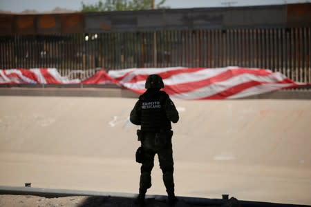 A Mexican soldier keeps watch at the border during an operation to inhibit migrants to cross illegally into the United States, according to local media, in Ciudad Juarez