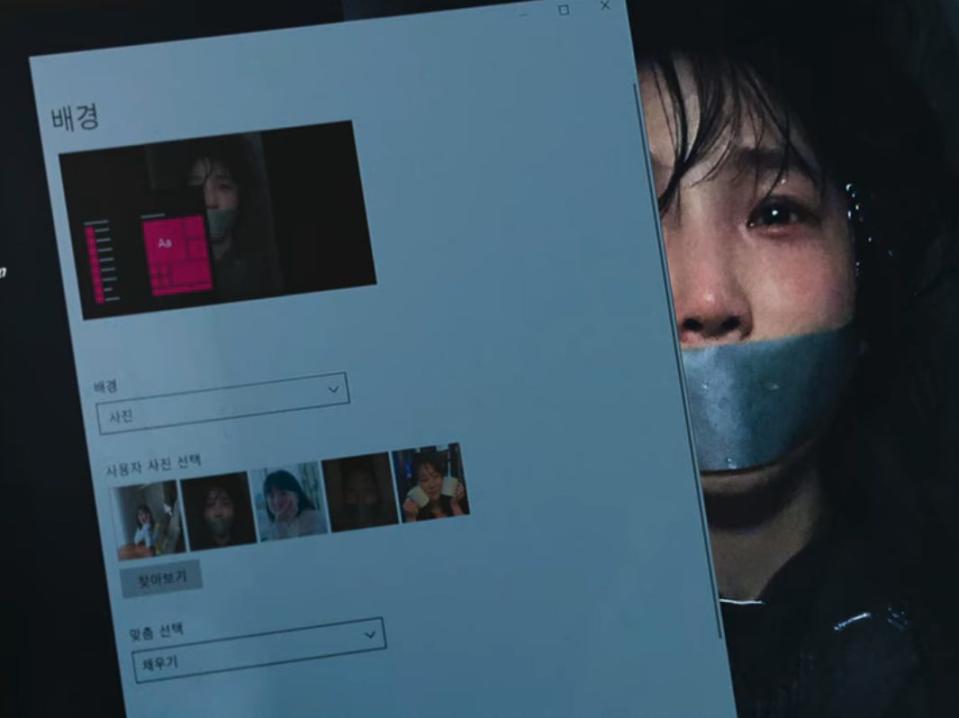 jun-yeong's laptop in unlocked. his background, half visible, shows a fearful woman with tape over her mouth laying in water. on the left, where he's changing his background, there's a row showing alternating smiling women and then photos of them bound and terrified