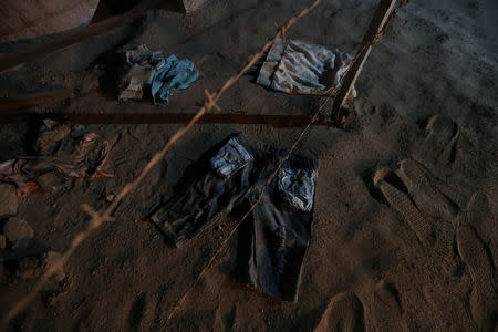 Migrants' clothes are seen during a police patrol at a restricted mined area of desert, at the Chilean and Peruvian border in Arica, Chile, November 16, 2018. REUTERS/Ivan Alvarado
