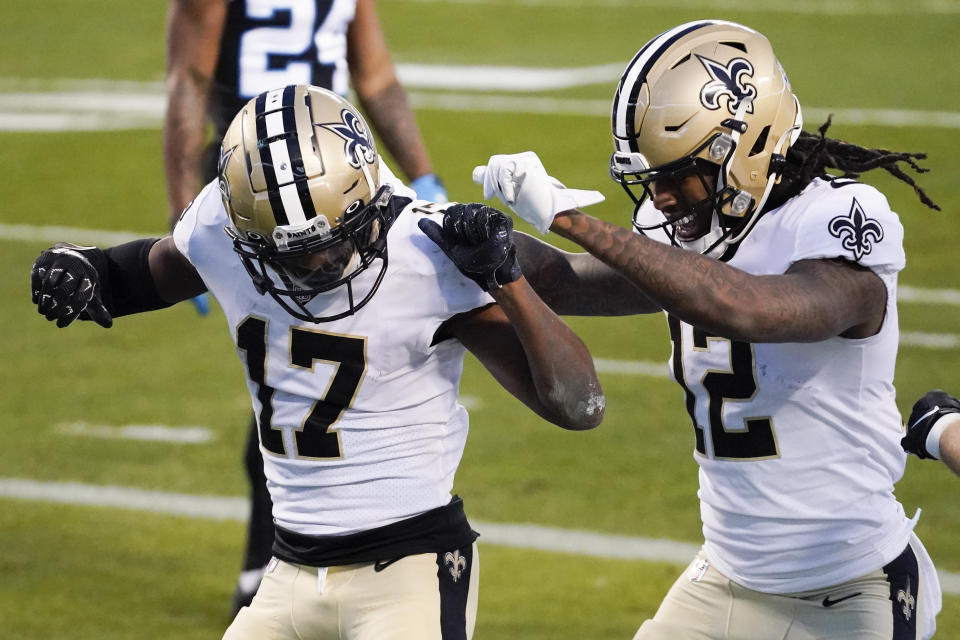 New Orleans Saints wide receiver Emmanuel Sanders celebrates after scoring with wide receiver Marquez Callaway during the first half of an NFL football game against the Carolina Panthers Sunday, Jan. 3, 2021, in Charlotte, N.C. (AP Photo/Gerry Broome)