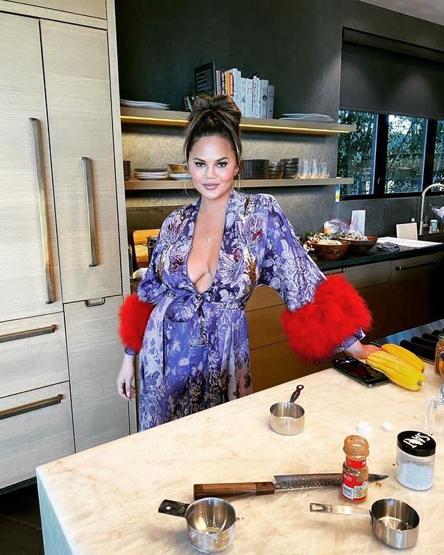 <p>Teigen, who told PEOPLE that the family would be downsizing their Thanksgiving this year "making it much more about enjoying the time with [family]," <a href="https://www.instagram.com/p/CIExzzlp4vb/" rel="nofollow noopener" target="_blank" data-ylk="slk:posted a photo of her prepping the meal;elm:context_link;itc:0;sec:content-canvas" class="link ">posted a photo of her prepping the meal</a> in a gorgeous robe. </p> <p>"Happy thanksgiving, my loves," the <em>Cravings </em>author wrote. </p>