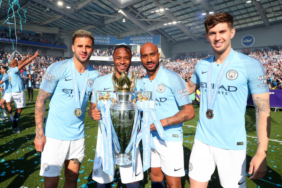 Kyle Walker, Raheem Sterling, Fabian Delph and John Stones with the Premier League Trophy (Photo by Victoria Haydn/Man City via Getty Images)