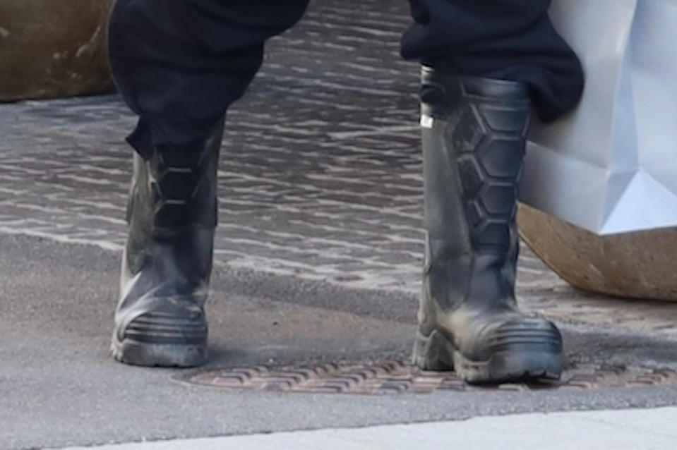 A closer look at Kanye West’s tall black boots. - Credit: SplashNews.com