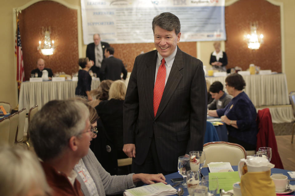 Republican U.S. Rep. John Faso speaks to people before the start of a candidate forum in Poughkeepsie, N.Y., Wednesday, Oct. 17, 2018. The race in the 19th Congressional District pits Faso against Democrat Antonio Delgado, a rapper-turned-corporate lawyer seeking his first political office.(AP Photo/Seth Wenig)