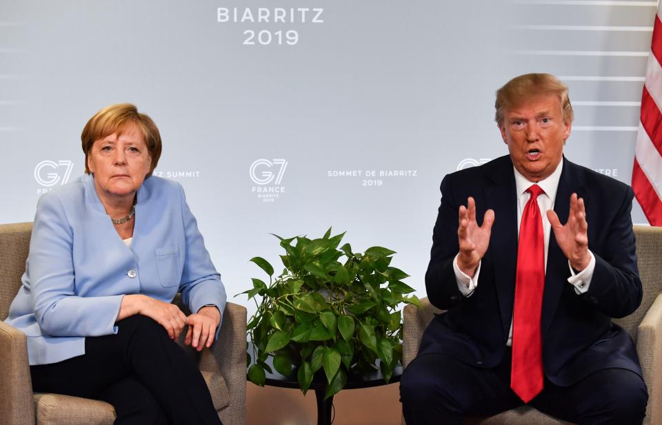 German Chancellor Angela Merkel (L) and US President Donald Trump 