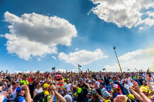 Marc Marquez climbed into the crowd to celebrate with fans after a ninth straight victory at the Sachsenring