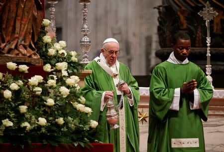 Pope Francis leads a special mass to mark International Migrants Day in Saint Peter's Basilica at the Vatican January 14, 2018. REUTERS/Max Rossi