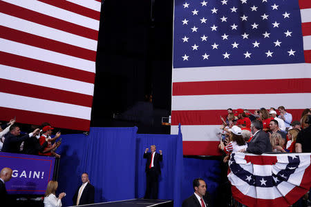 U.S. President Donald Trump gestures good bye at the end of his Make America Great Again rally at Nashville Municipal Auditorium in Nashville, Tennessee, U.S., May 29, 2018. REUTERS/Leah Millis