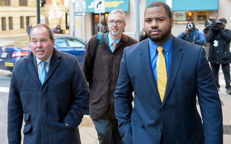 Baltimore Police Officer William Porter (R) and his attorneys Joseph Murtha (L) and Gary Proctor arrive at the courthouse for pretrial hearings in the case of Caeser Goodson in Baltimore, Maryland, January 6, 2016. REUTERS/Bryan Woolston