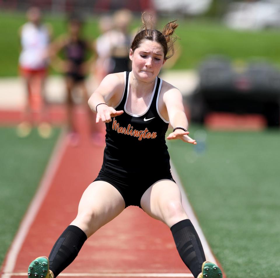 Marlington's Ariana Painter jumps to a first place finish of Girls Long Jump final of the 2022 NEO Division II Districts Track & Field  at Salem High School.  Saturday,  May 21, 2022.