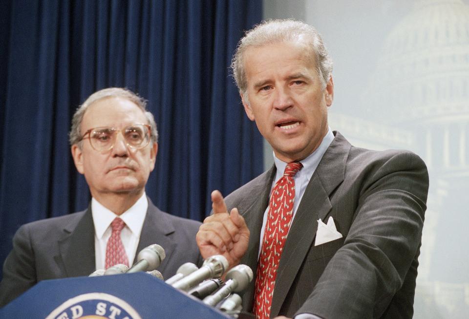 Sen. Joe Biden, D-Del., right, accompanied by Senate Majority Leader George Mitchell of Maine, at a Capitol Hill news conference on Aug. 25, 1994, after the Senate voted to push the $30 billion crime bill.