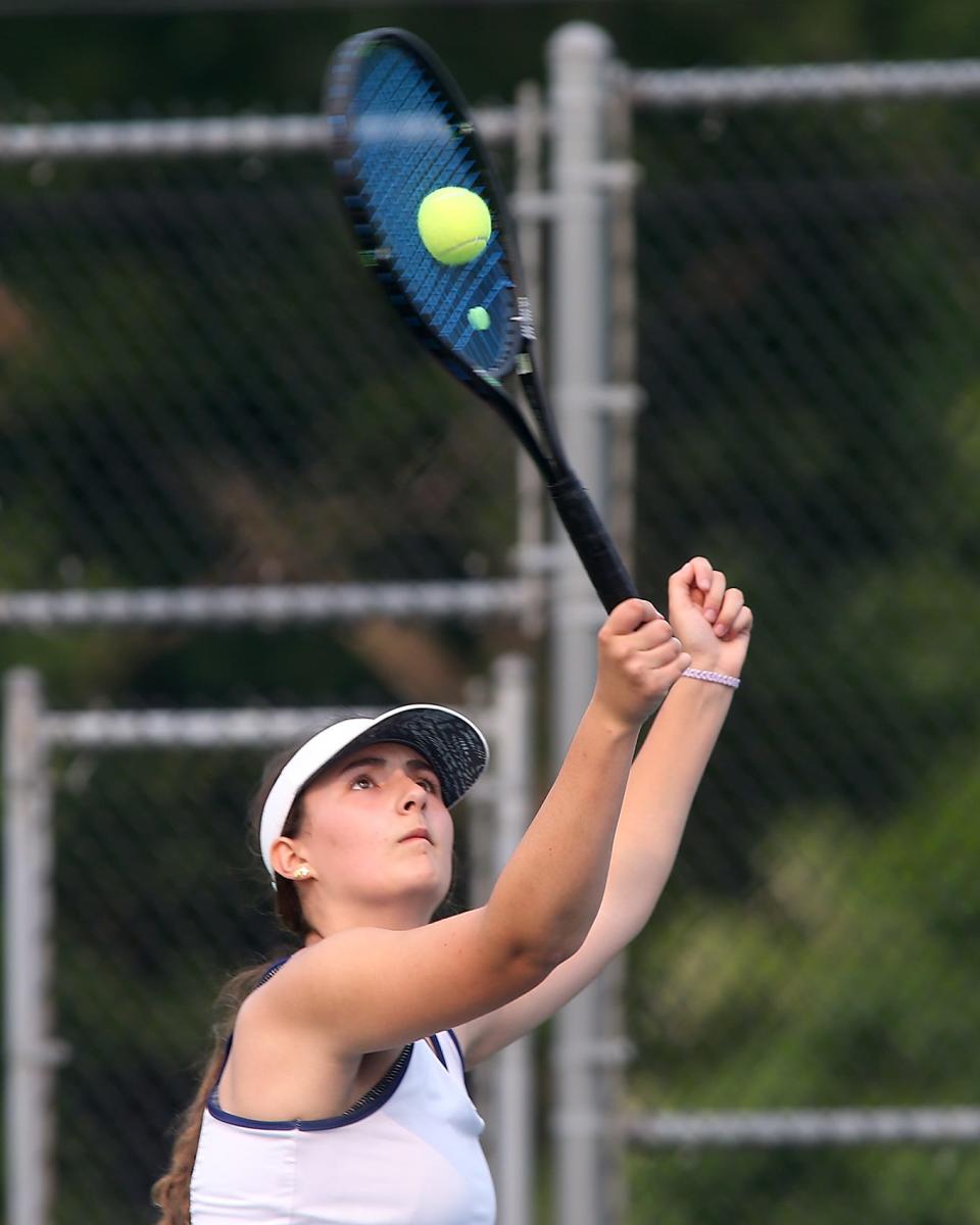 Notre Dame Academy’s #1 doubles Bella LaGrassa eyes her smash during her Sweet 16 match against Scituate in the Division 2 State Tournament at the Gates Middle School Tennis Courts in Scituate on Tuesday, June 6, 2023. 