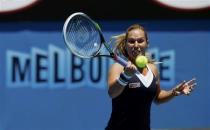 Dominika Cibulkova of Slovakia hits a return to Francesca Schiavone of Italy during their women's singles match at the Australian Open 2014 tennis tournament in Melbourne January 14, 2014. REUTERS/Bobby Yip