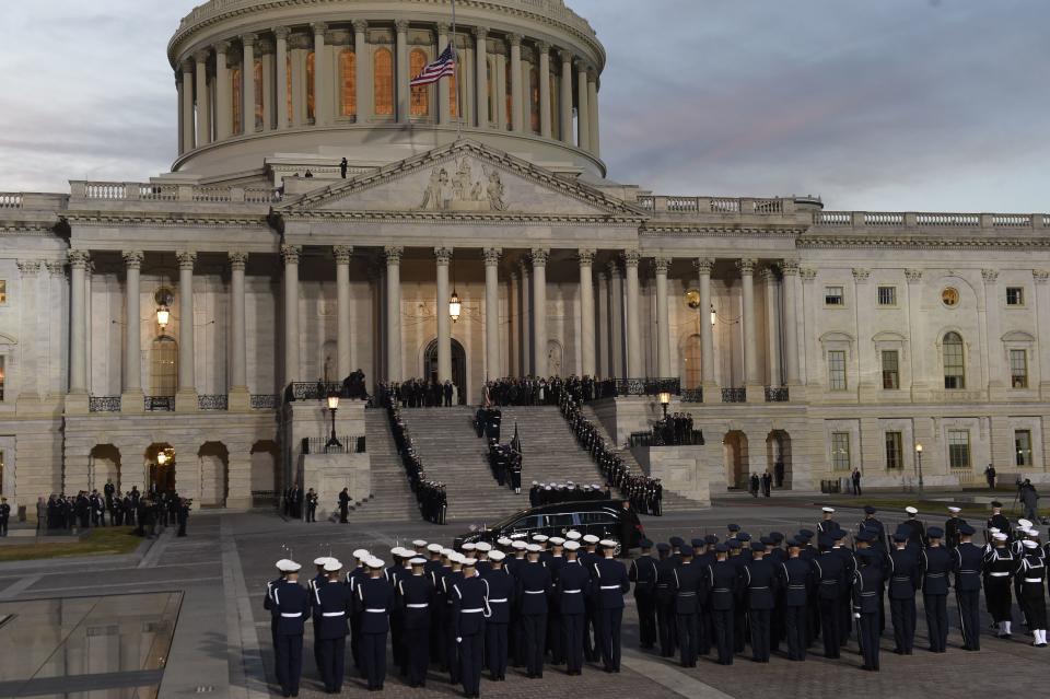 The casket bearing Bush's remains arrives at the Capitol.