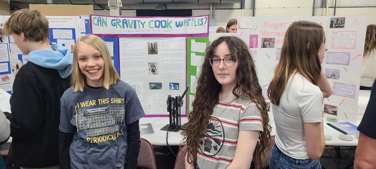 Austin Dunn, left, and Lucy MacArthur stand next to their electrical generator prototype at the P.E.I. Science Fair at Charlottetown's Eastlink Centre on Tuesday. The pair of Grade 8 students at East Wiltshire Intermediate School in Cornwall, P.E.I., built their 